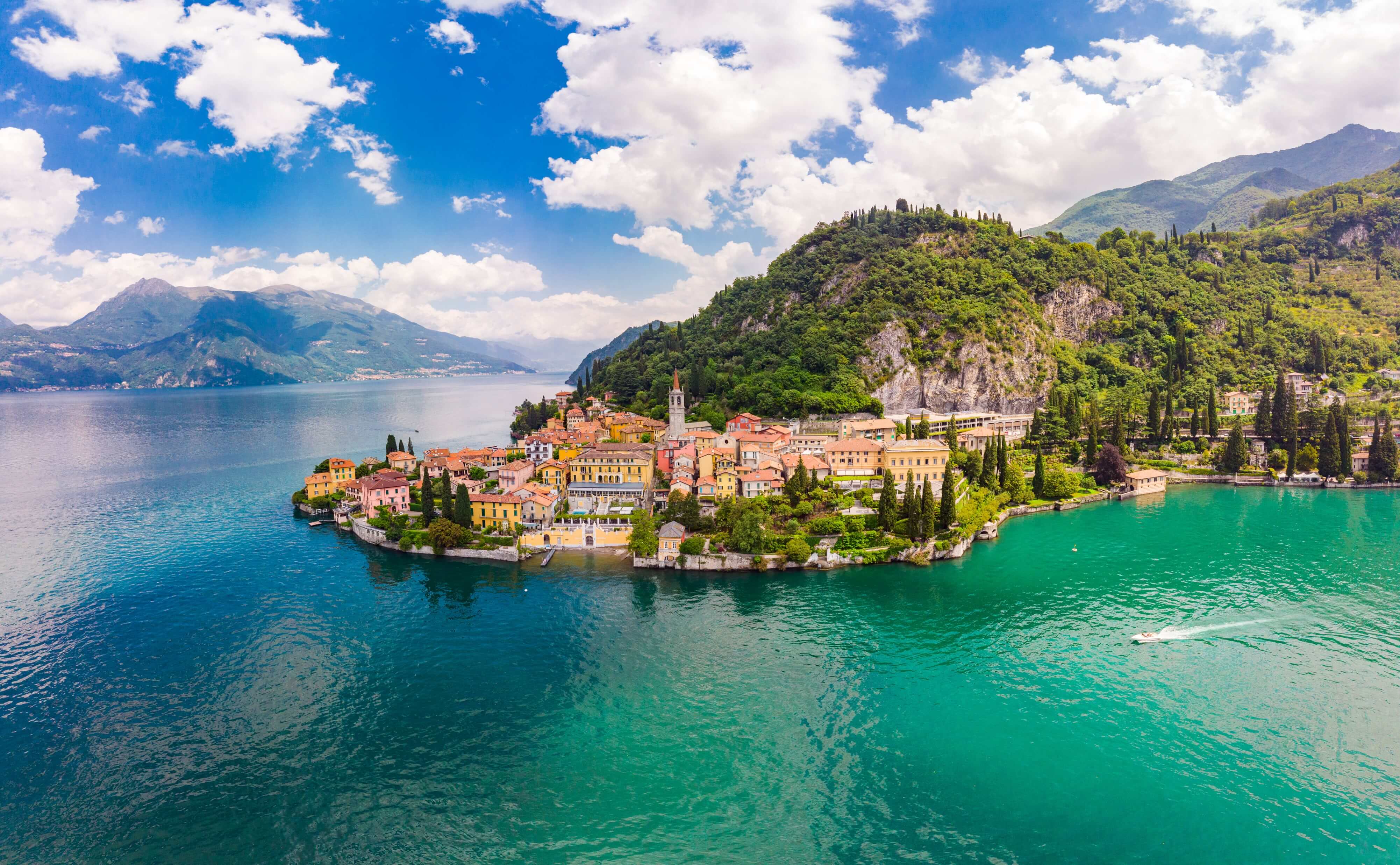 Beautifull aerial panoramic view from the drone to the Varenna - famous old Italy town on bank of Como lake.